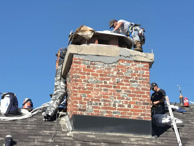 Meriden Chimney Sweep installing a custom chimney crown in Meriden, CT