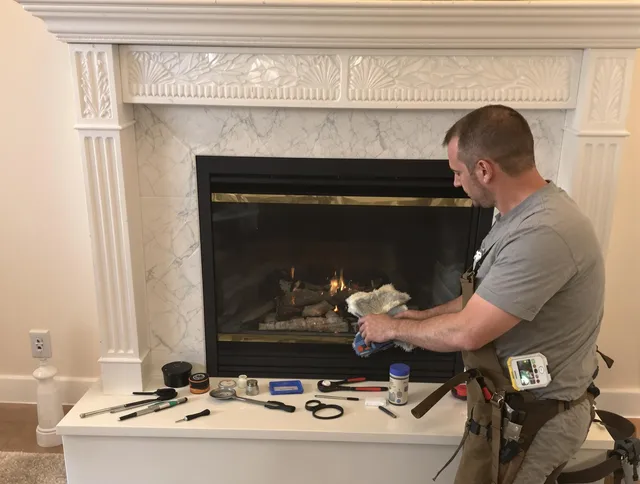 Meriden Chimney Sweep performing fireplace maintenance in Meriden, CT